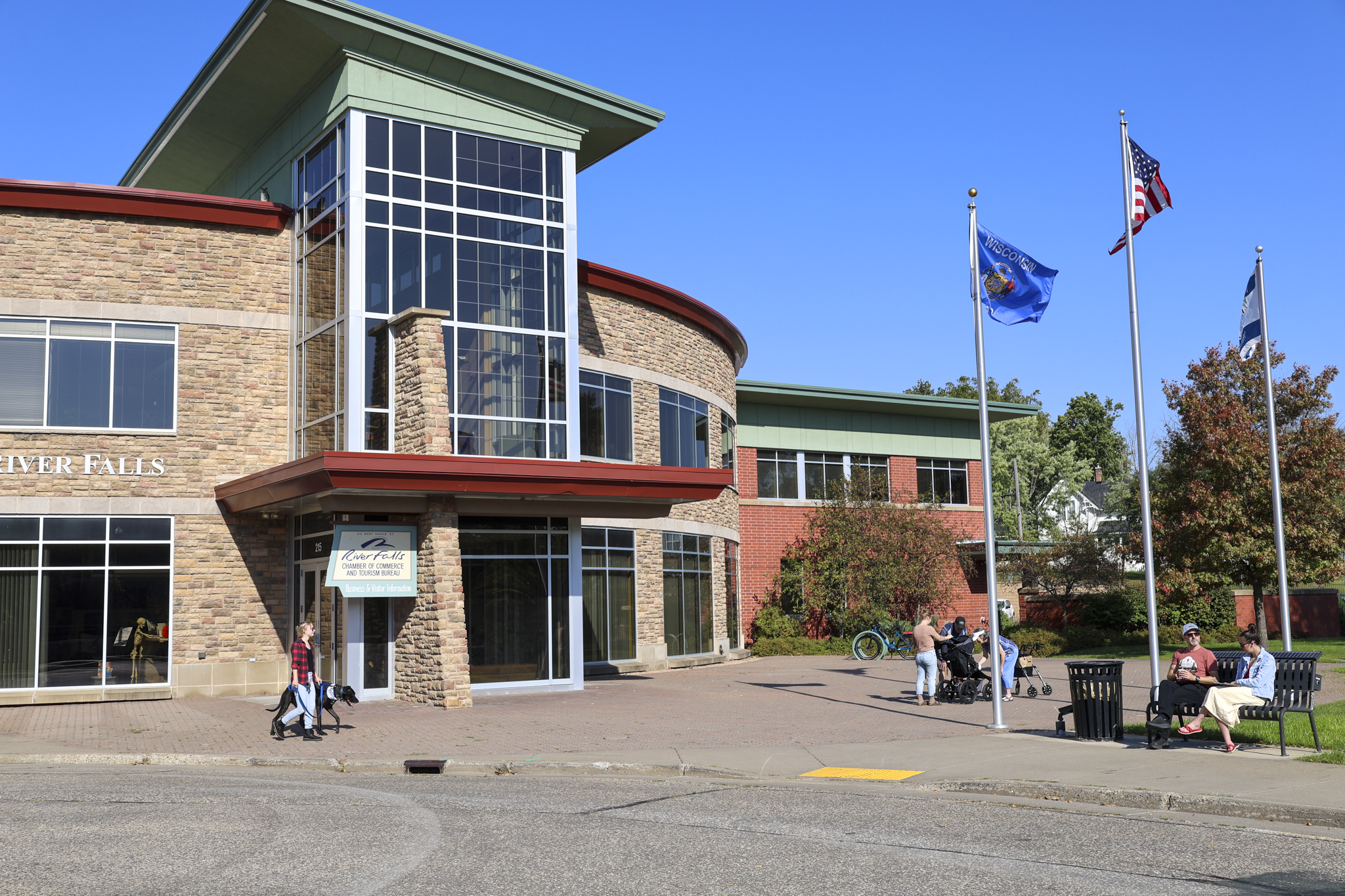 River Falls City Hall with people on the plaza